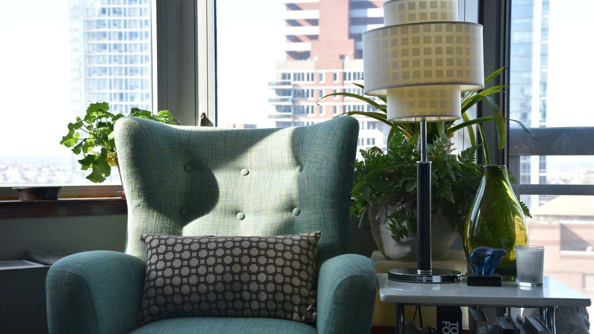 grey and white throw pillow on grey sofa chair