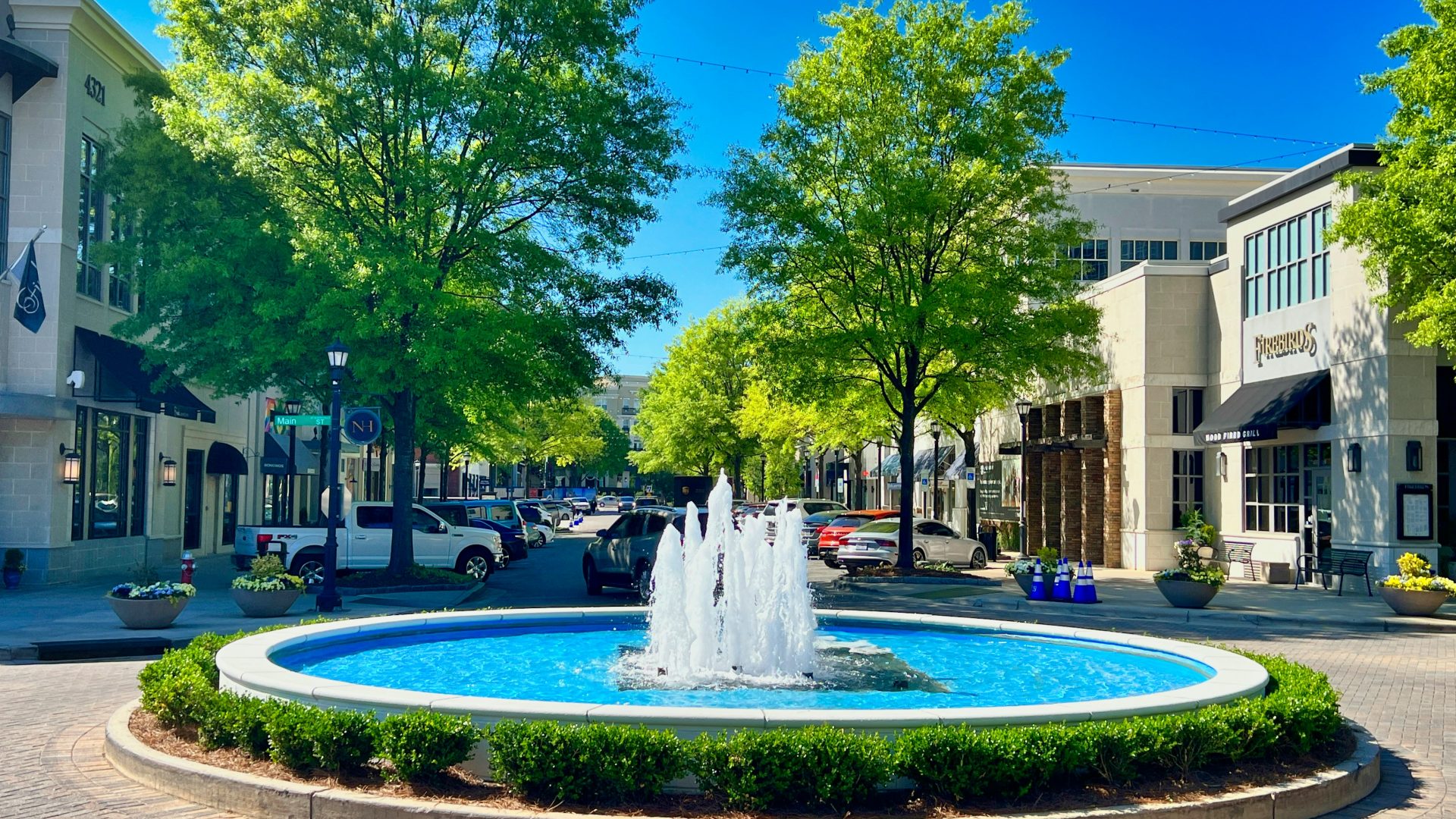 a fountain in the middle of a city square